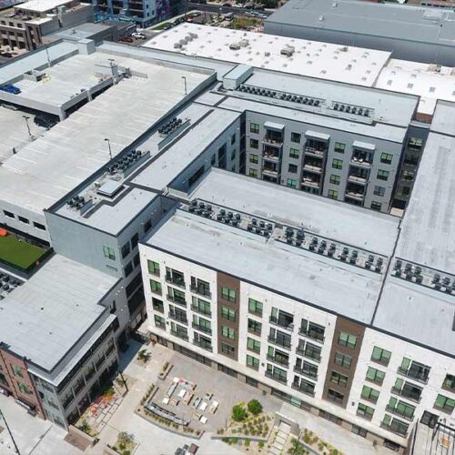 An aerial photo of a Vertical Roofing project - a commercial reroof for Camden Rino in Denver, Colorado
