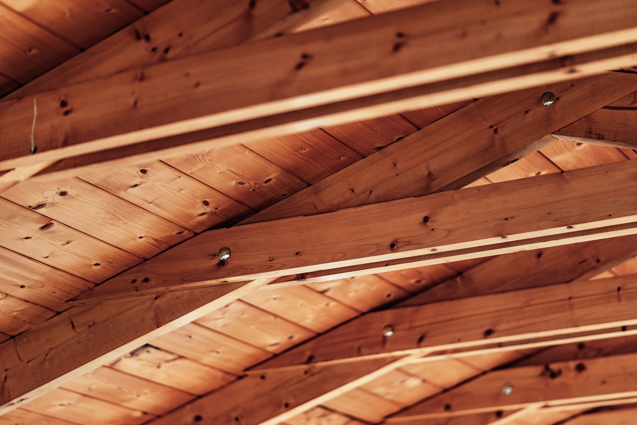 Close-up of finished wood roof decking or attic framing.