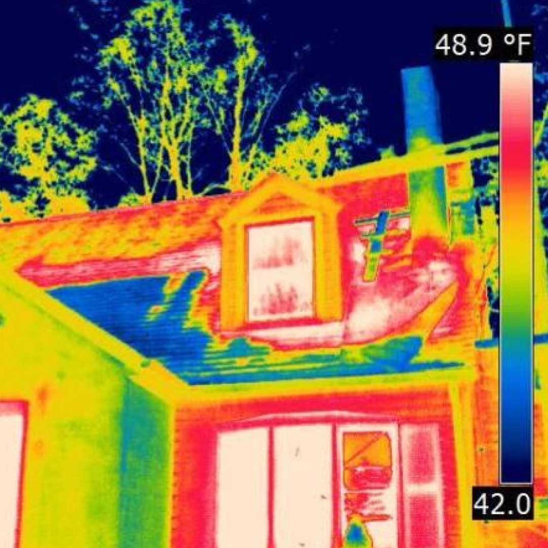 Thermal imaging scan showing heat loss patterns on a building exterior.